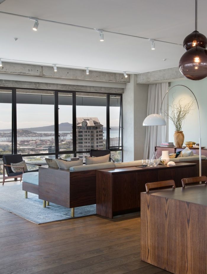 Paired with simple white walls and a combination of industrial and sleek, modern finishes, the rich maple and chestnut hues of the Natural and Smokey-coloured Oak are a tasteful addition to the material palette.