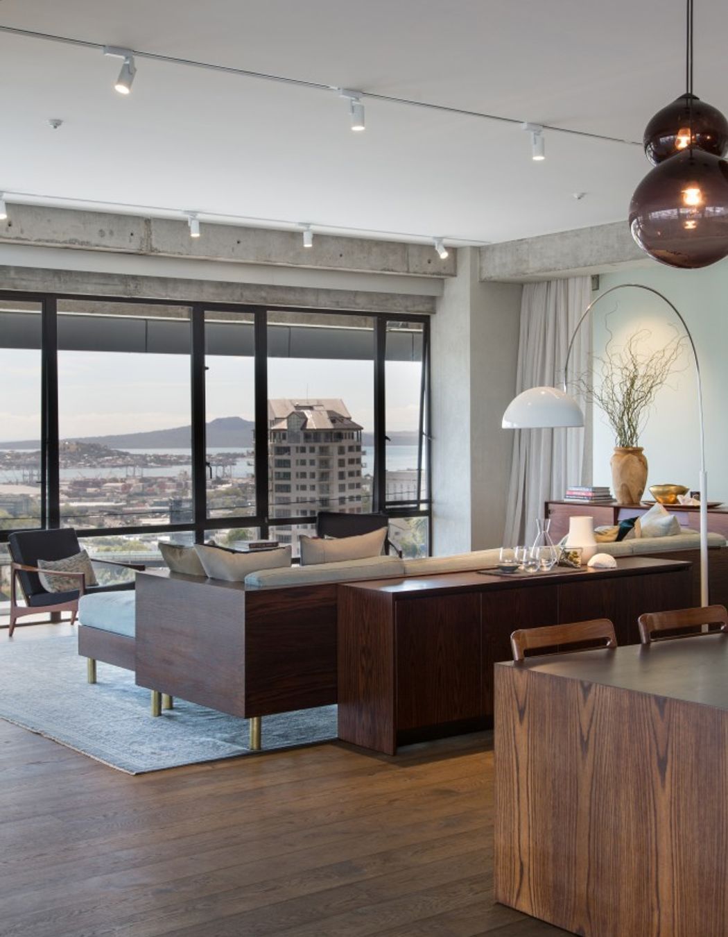 Paired with simple white walls and a combination of industrial and sleek, modern finishes, the rich maple and chestnut hues of the Natural and Smokey-coloured Oak are a tasteful addition to the material palette.