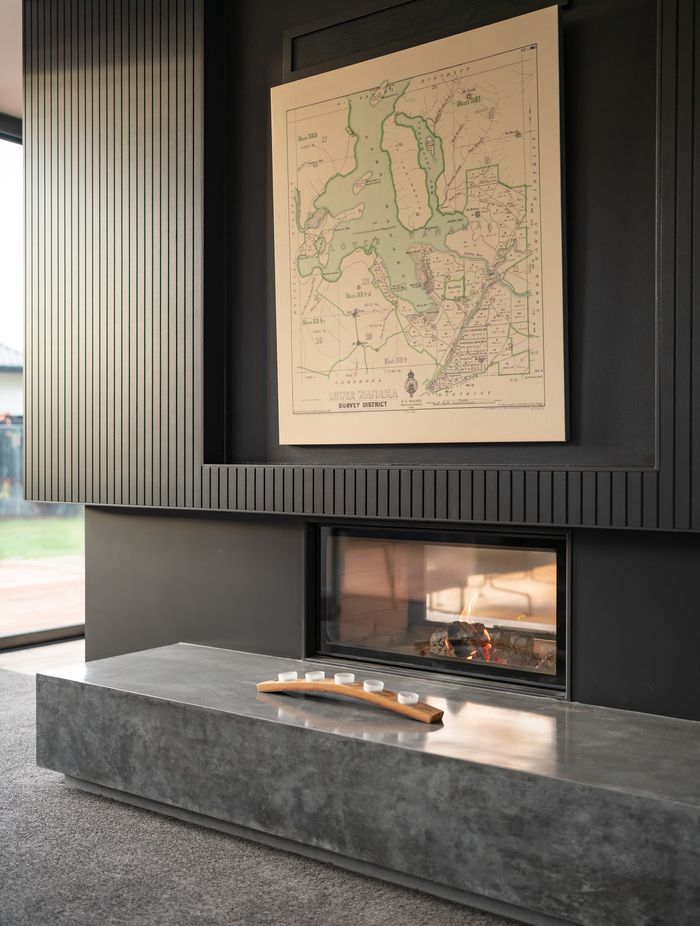 The Escea Spartherm double-sided fireplace divides two living areas without completely separating them.