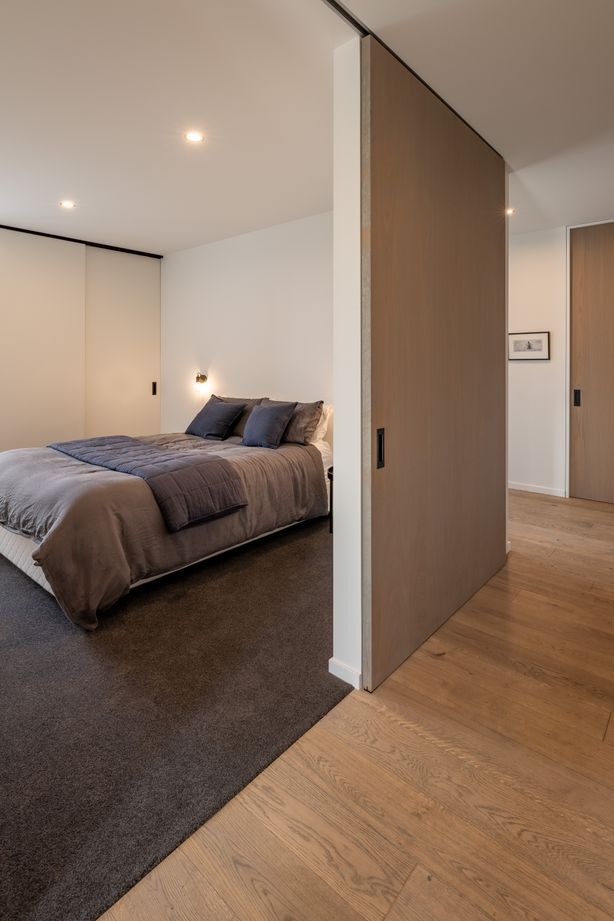 All doors and sliders are full height, to create a feeling of scale as well as to improve cross-ventilation. The house is very thermally efficient and also has a ducted heat pump system.