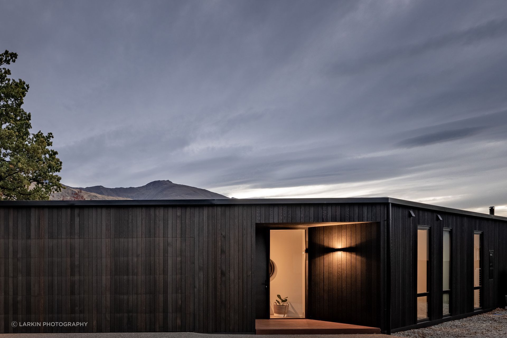 The sleek holiday home in Wanaka designed by Warwick McLaren of McLaren Architecture.Design presents a simple facade. “The built form isn’t too tricky. The house was definitely done cost-effectively but in the end this doesn’t limit it.”