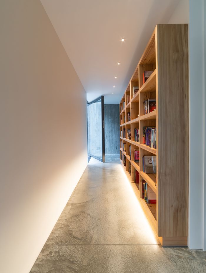 A gallery-style corridor leads through the second and third bedrooms.