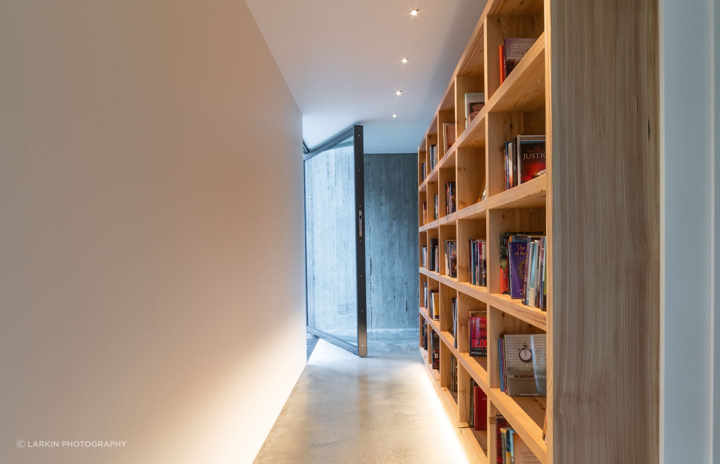 A gallery-style corridor leads through the second and third bedrooms.