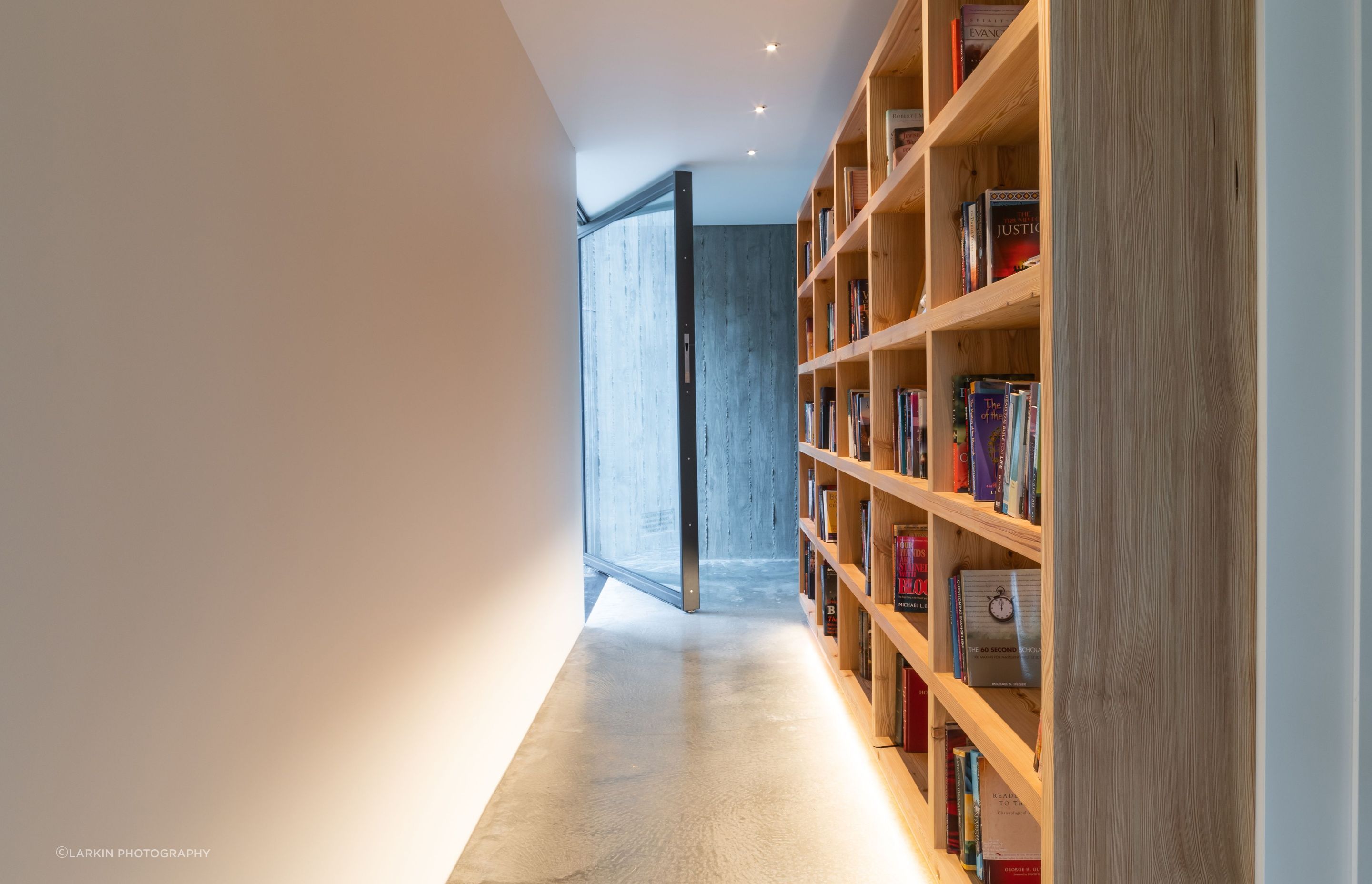 A gallery-style corridor leads through the second and third bedrooms.