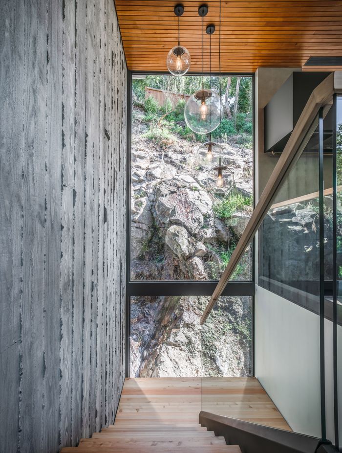 Exposed concrete walls are cohesive with the deep silver basalt, juxtaposing ideas of natural and manufactured Cantabrian materials.