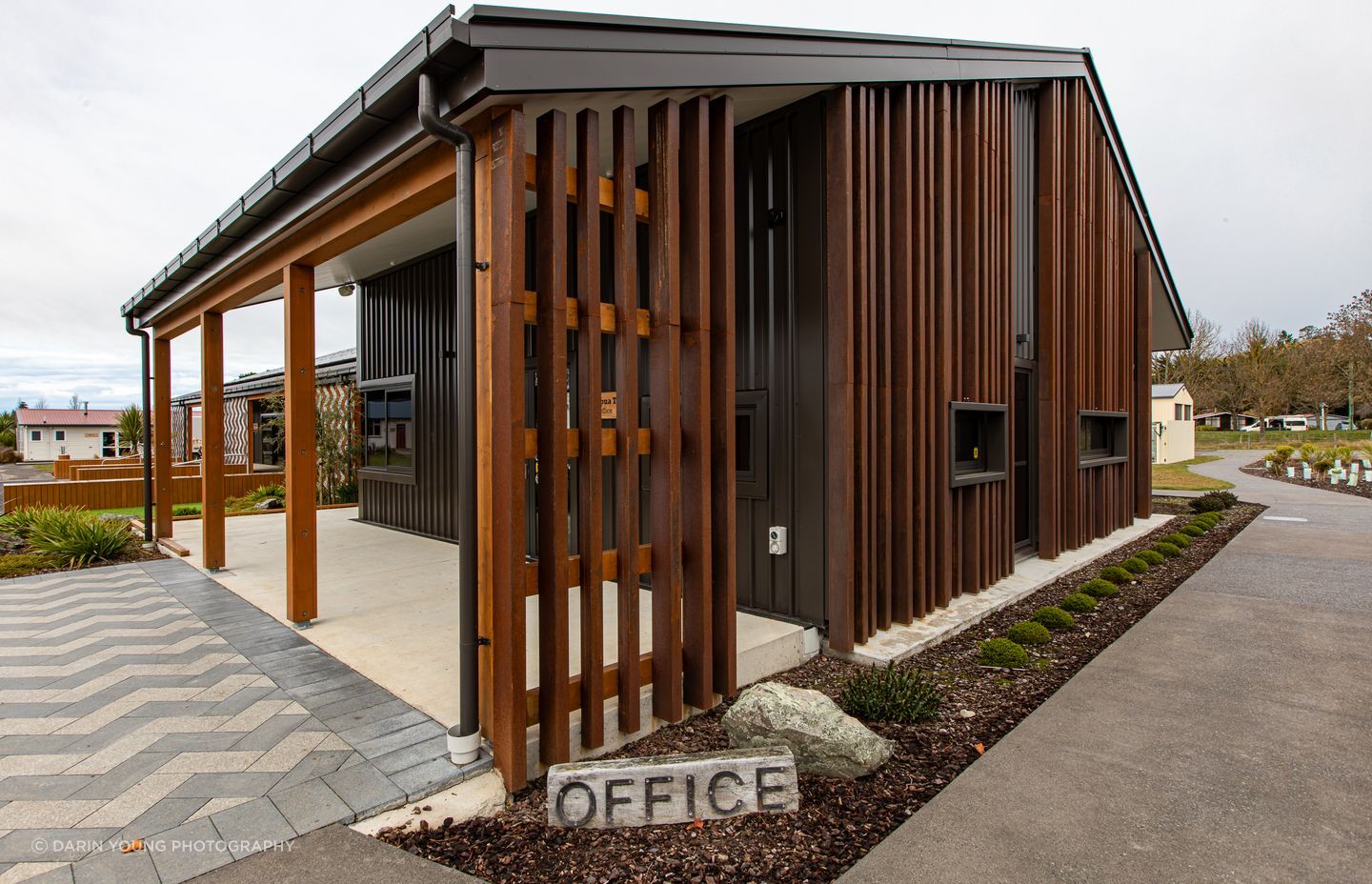 The basket weave of the rain screens is also reflected on the landscaping by Kamo Marsh.