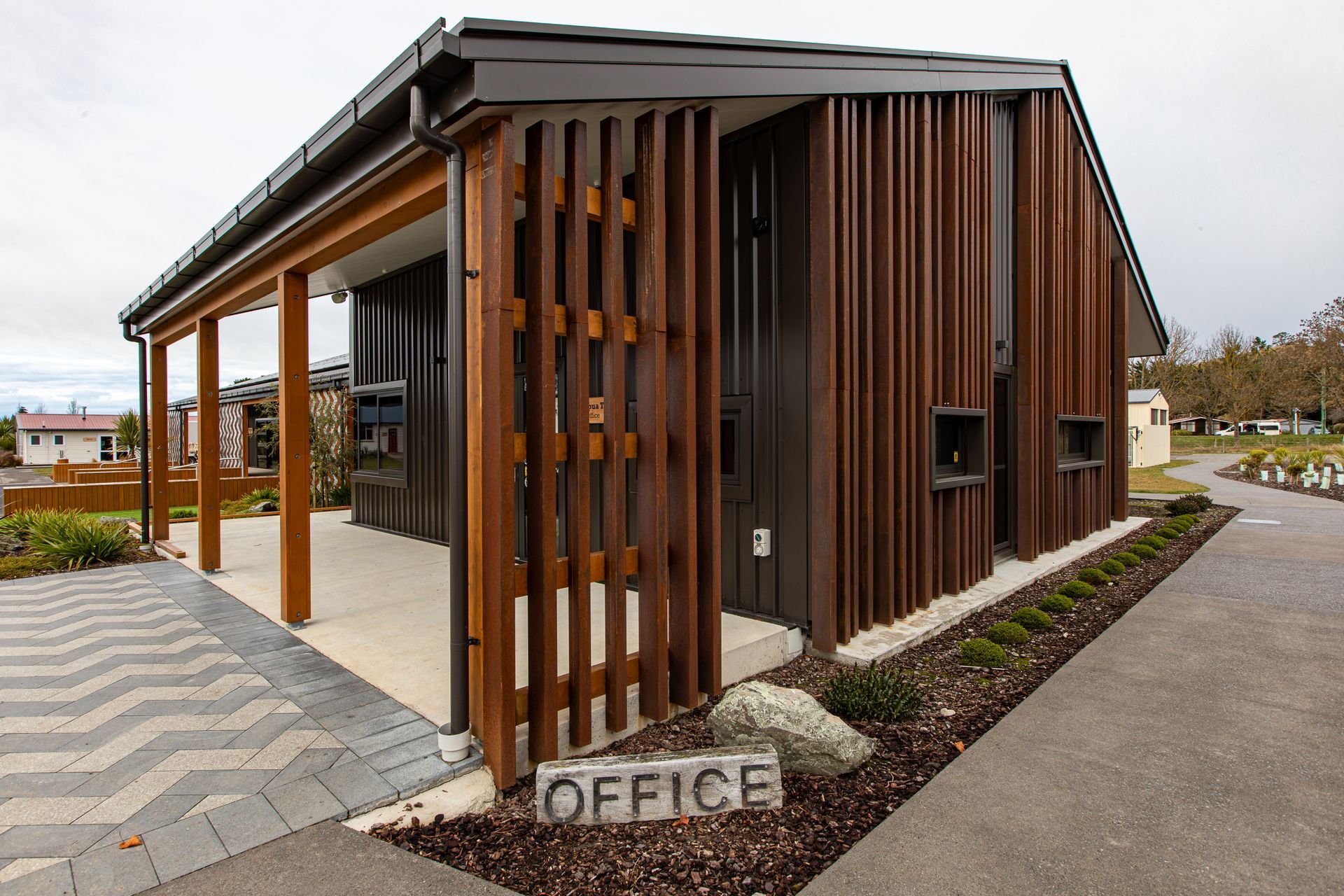 The basket weave of the rain screens is also reflected on the landscaping by Kamo Marsh.