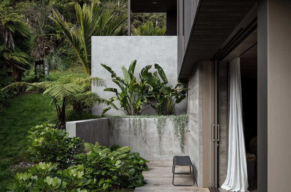 The outdoor shower. “There’s a double wall of concrete and the doors slide into a pocket between them. It looks easy, but actually building it is a real challenge,” says Evelyn. She mapped out the gardens, and Flora and Form designed and planted them.