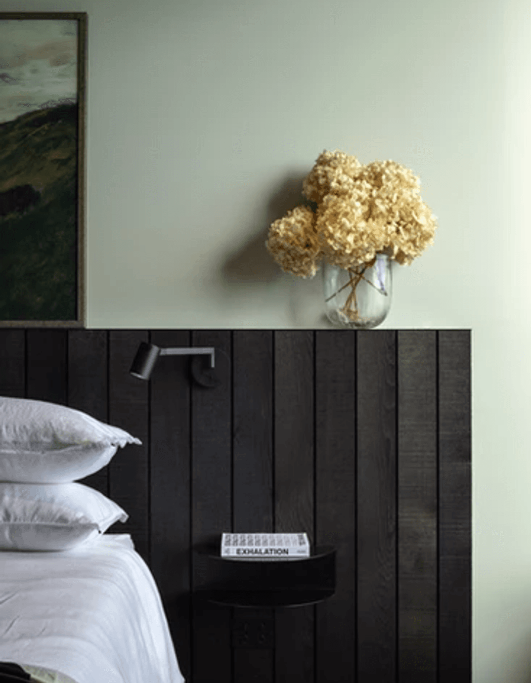 One of two master bedrooms that are both oriented to the views. The side table is from Made of Tomorrow.