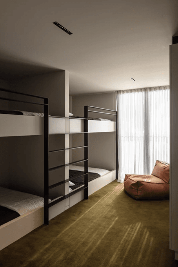 The spacious bunk rooms are upstairs. Fiona chose the Sallée carpet to fit the surroundings. “We've got the green bush all around us. And then across the lake the hills are a really lush, khaki green.”
