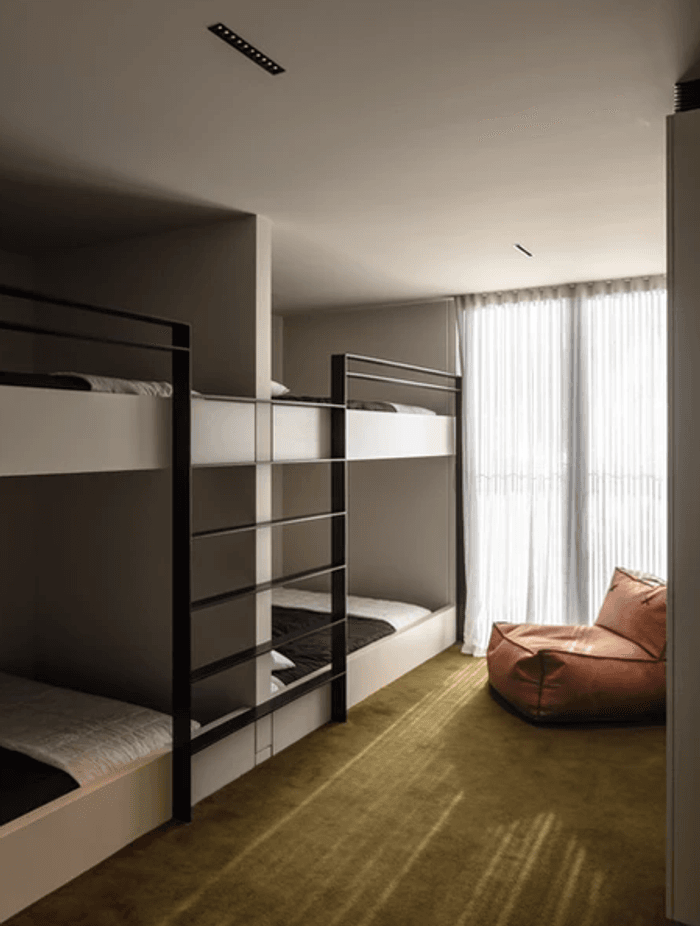 The spacious bunk rooms are upstairs. Fiona chose the Sallée carpet to fit the surroundings. “We've got the green bush all around us. And then across the lake the hills are a really lush, khaki green.”