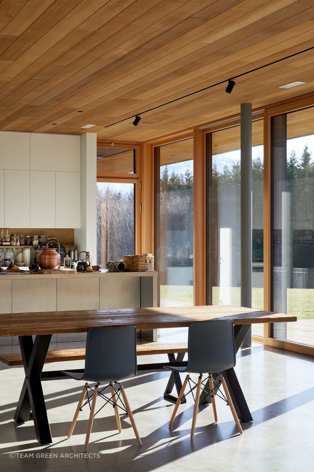 Timber ceilings warm the space.