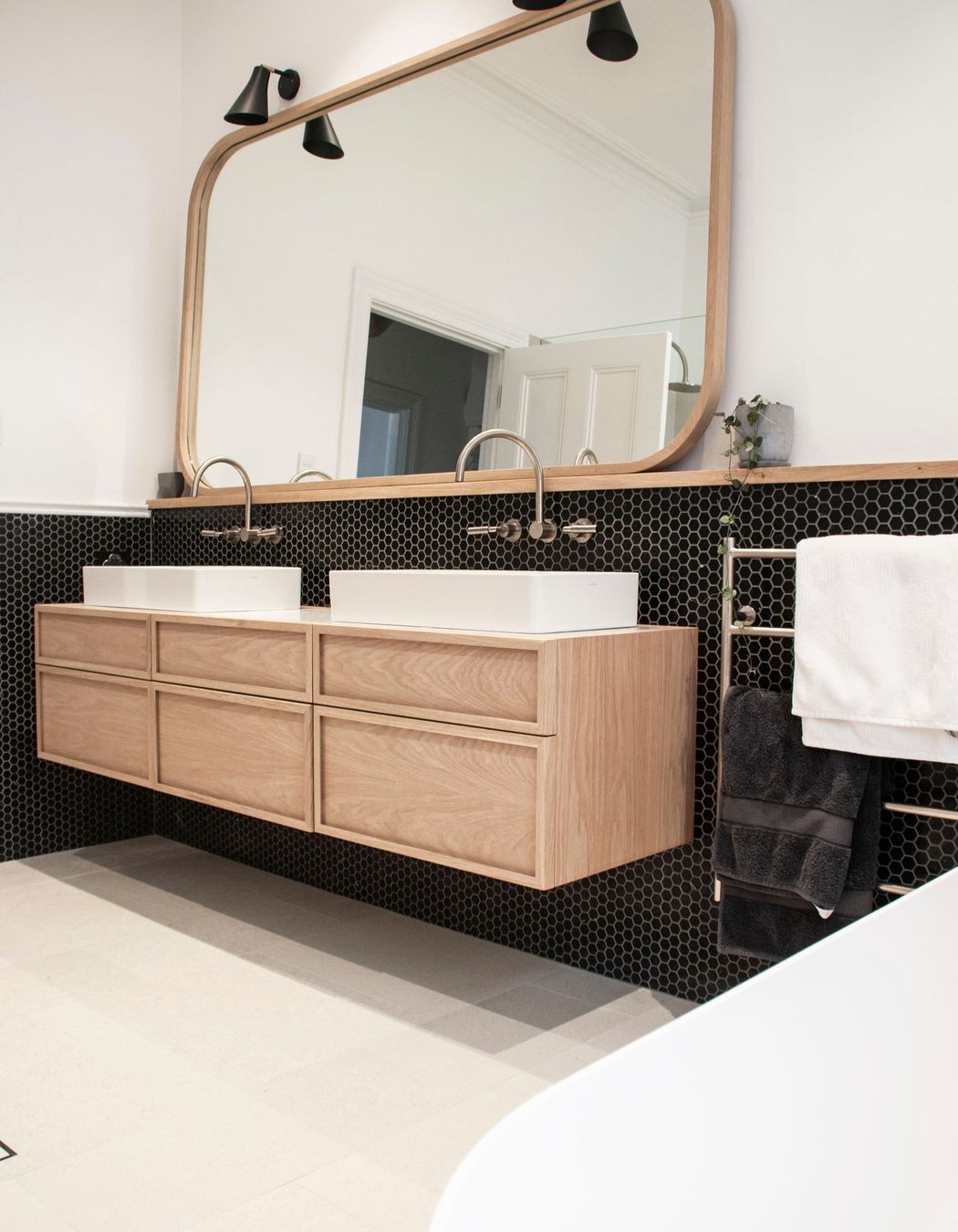 Black honeycombed shapped tiles line the walls | Photos by Jennifer Turner