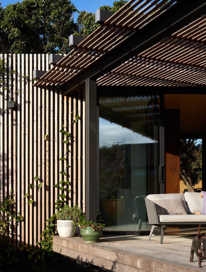 The timber battens double as a climbing frame for plants.