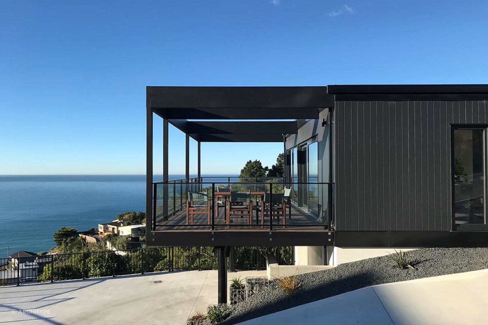 The home features cantilevered outdoor living space with movable shutters for privacy and shelter when needed.