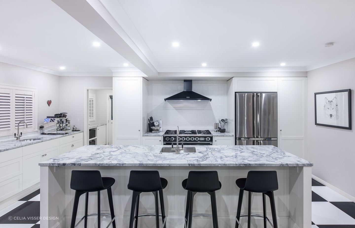 The black and white checkerboard flooring sets the scene in this stylish kitchen in St Heliers by Celia Visser Design.
