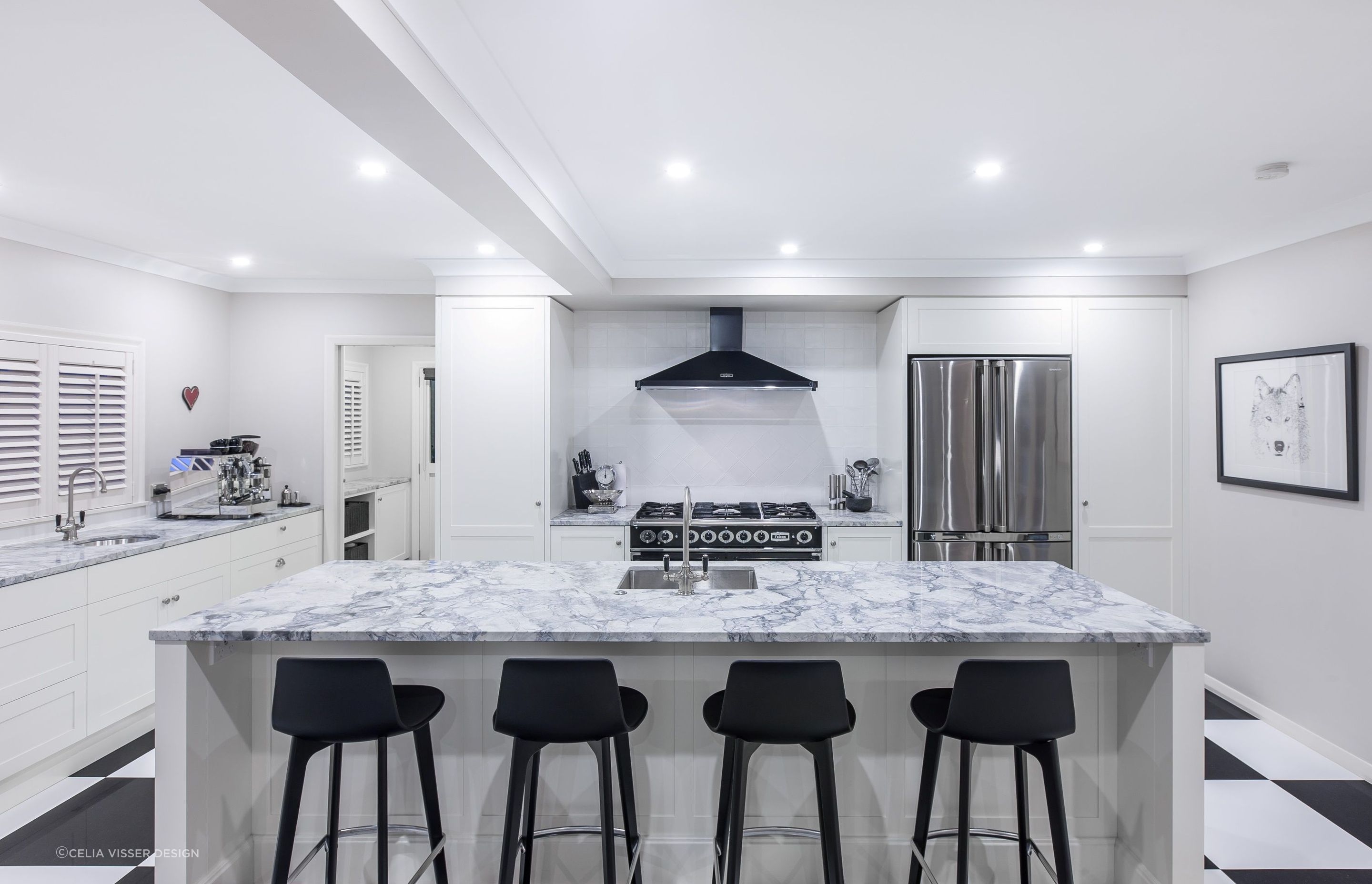 The black and white checkerboard flooring sets the scene in this stylish kitchen in St Heliers by Celia Visser Design.