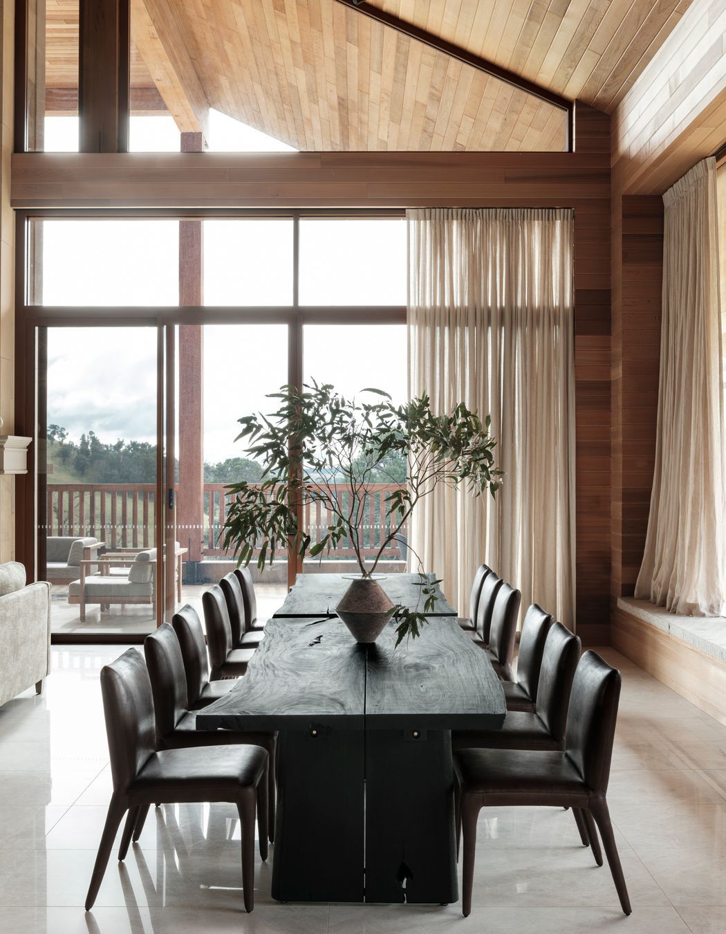 Across two dining tables, up to 14 people can gather for meals.