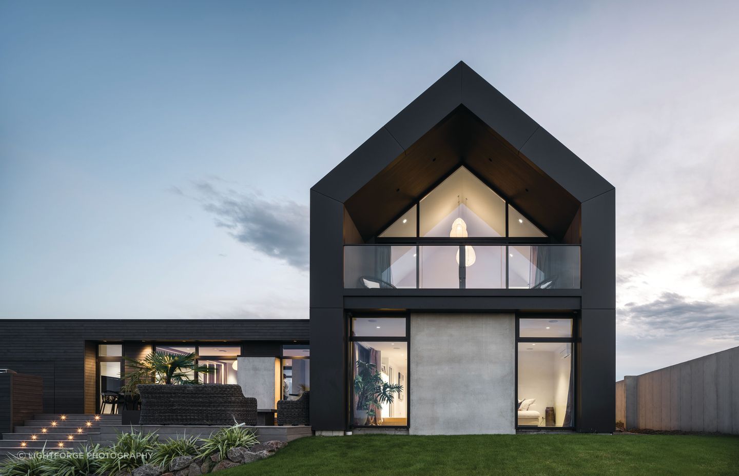 The home steps down with the land towards the lake.