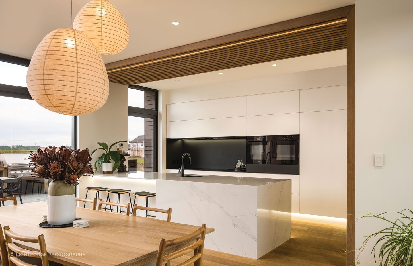 The living area is open and spacious, orientated north to capture the views and the sun.