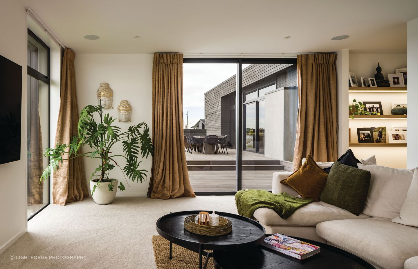 Soft textiles and creamy tones curate a calming spatial experience.