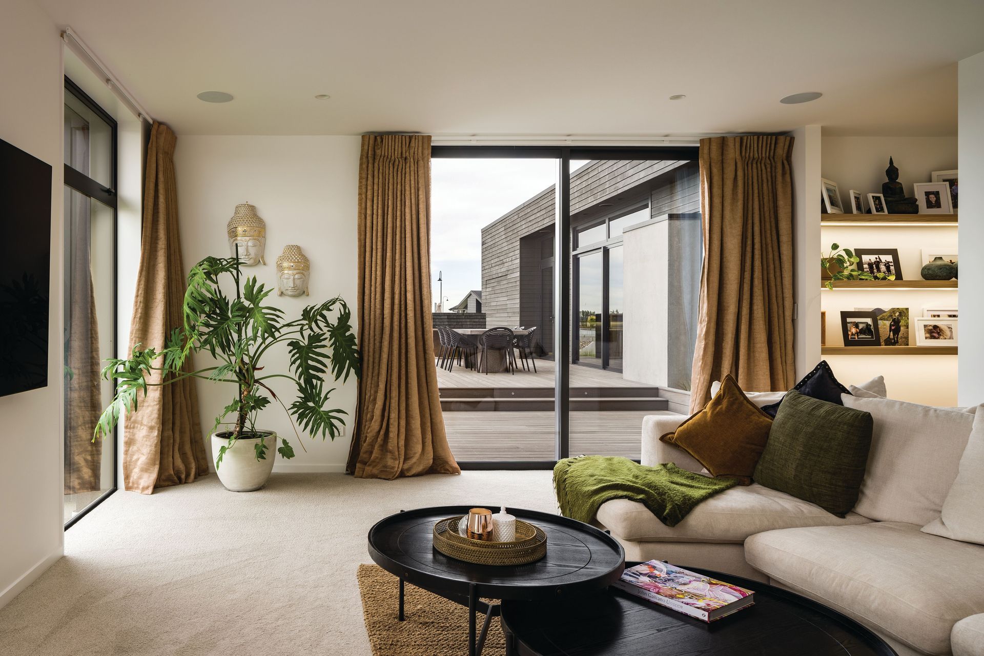 Soft textiles and creamy tones curate a calming spatial experience.