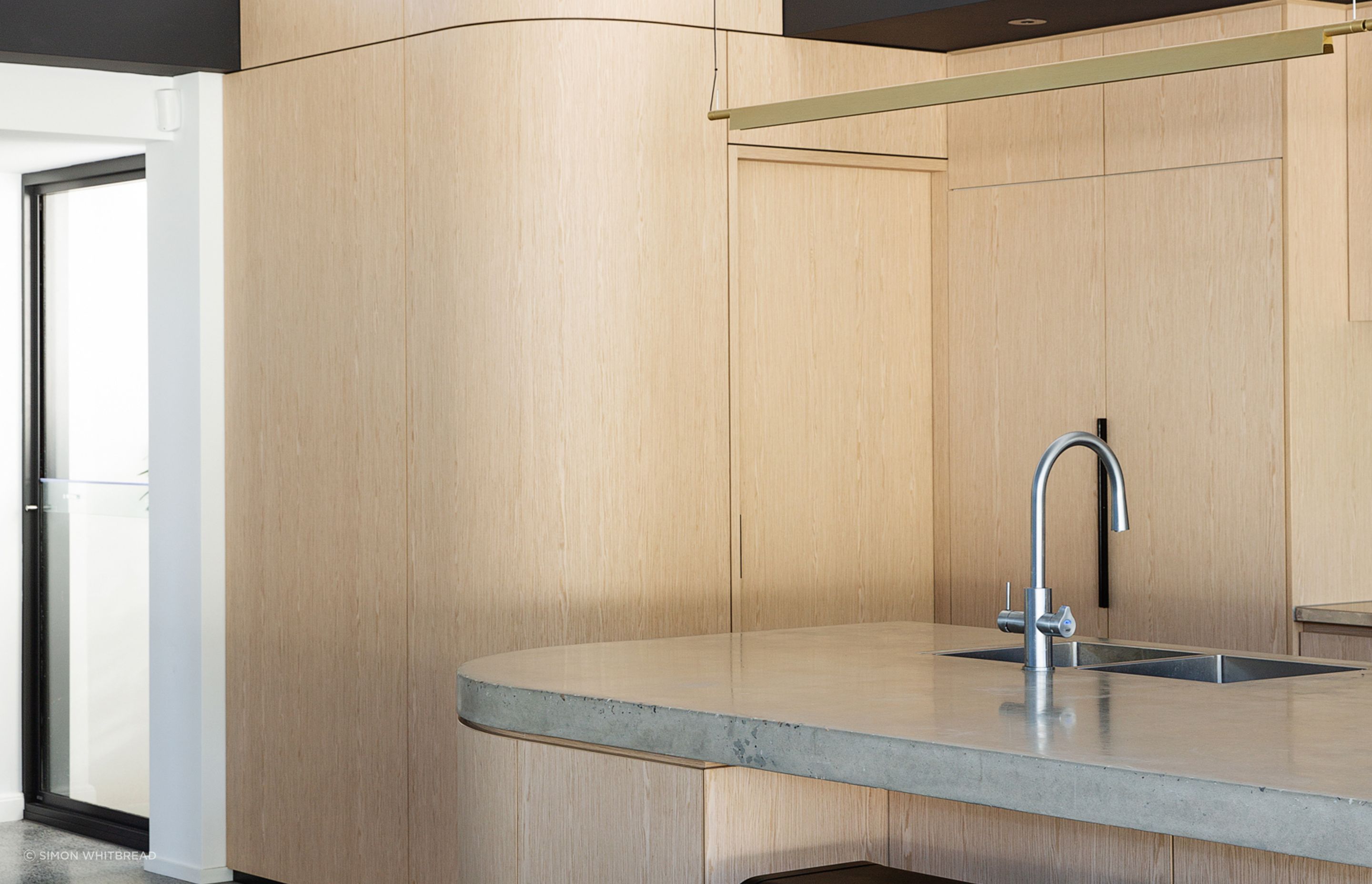 Clontarf Residence, Queensland: This residential project features Navlam Italian Oak, a pre-finished reconstructed timber veneer that achieves a warm oak tone throughout, inviting everyone into the space.