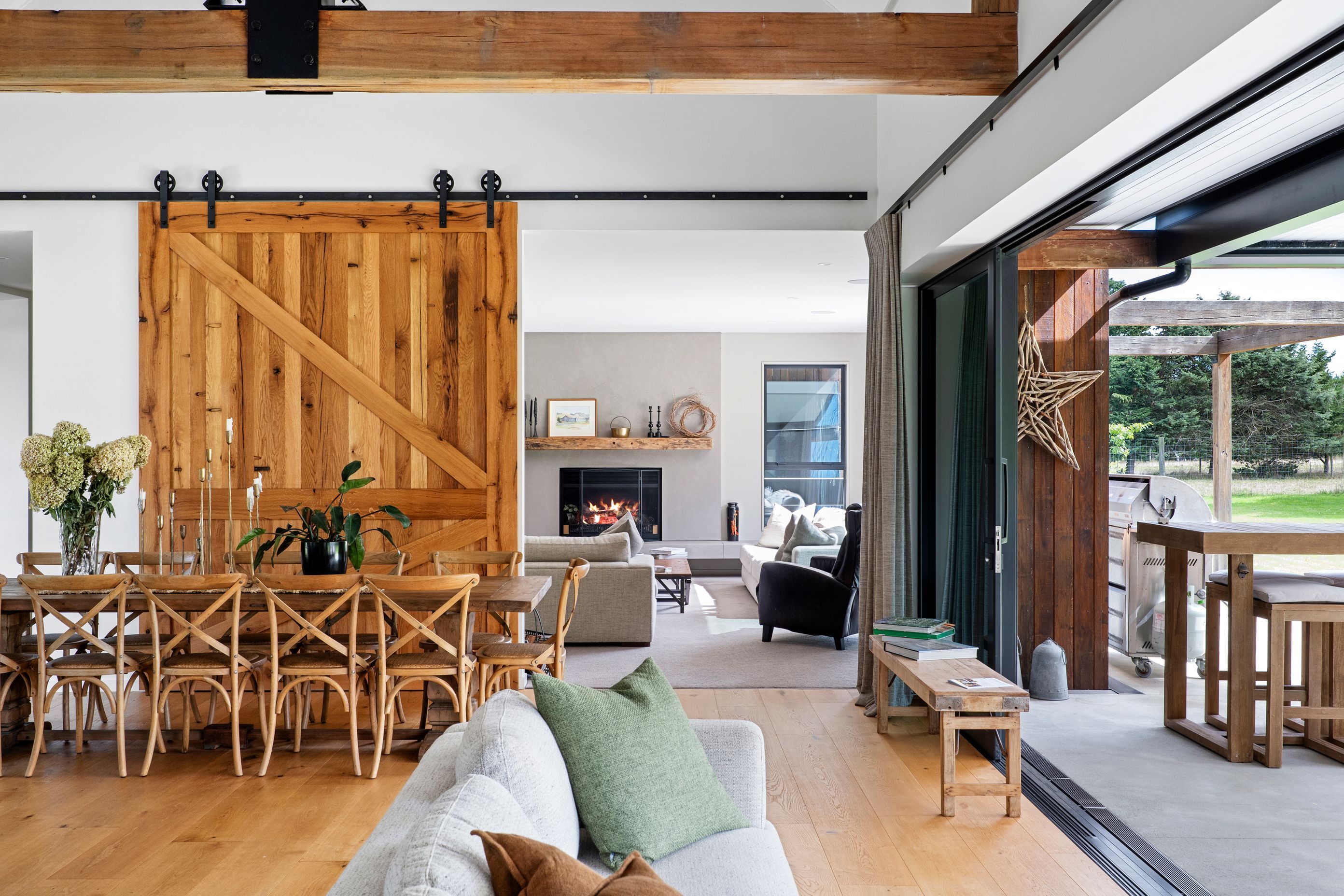 The timber barn door can be closed to enjoy the warmth of the fireplace in the lounge room.