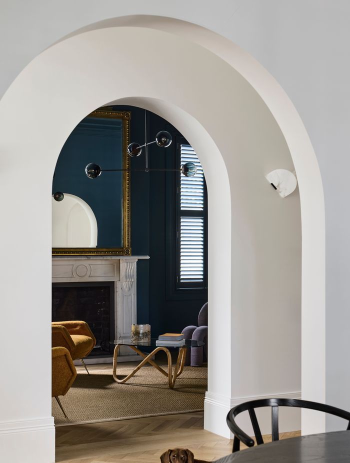 Arched openings from the hallway to the living spaces.
