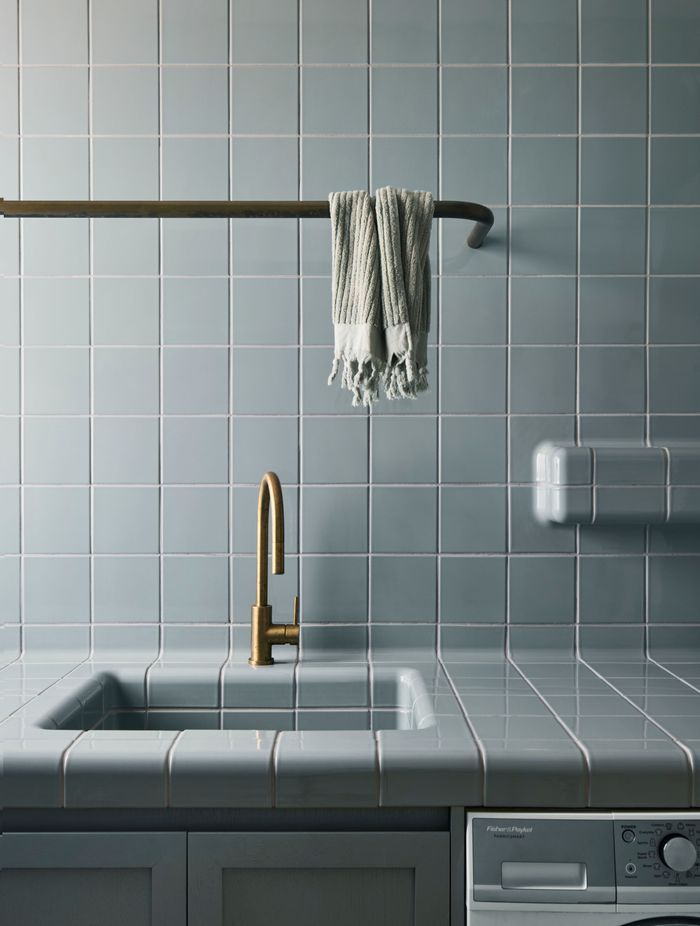 Muted tones in the traditionally tiled laundry.