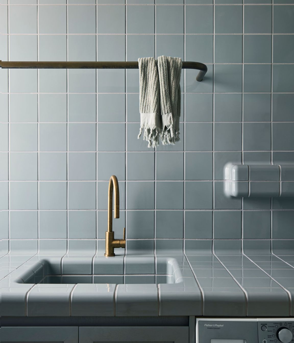 Muted tones in the traditionally tiled laundry.