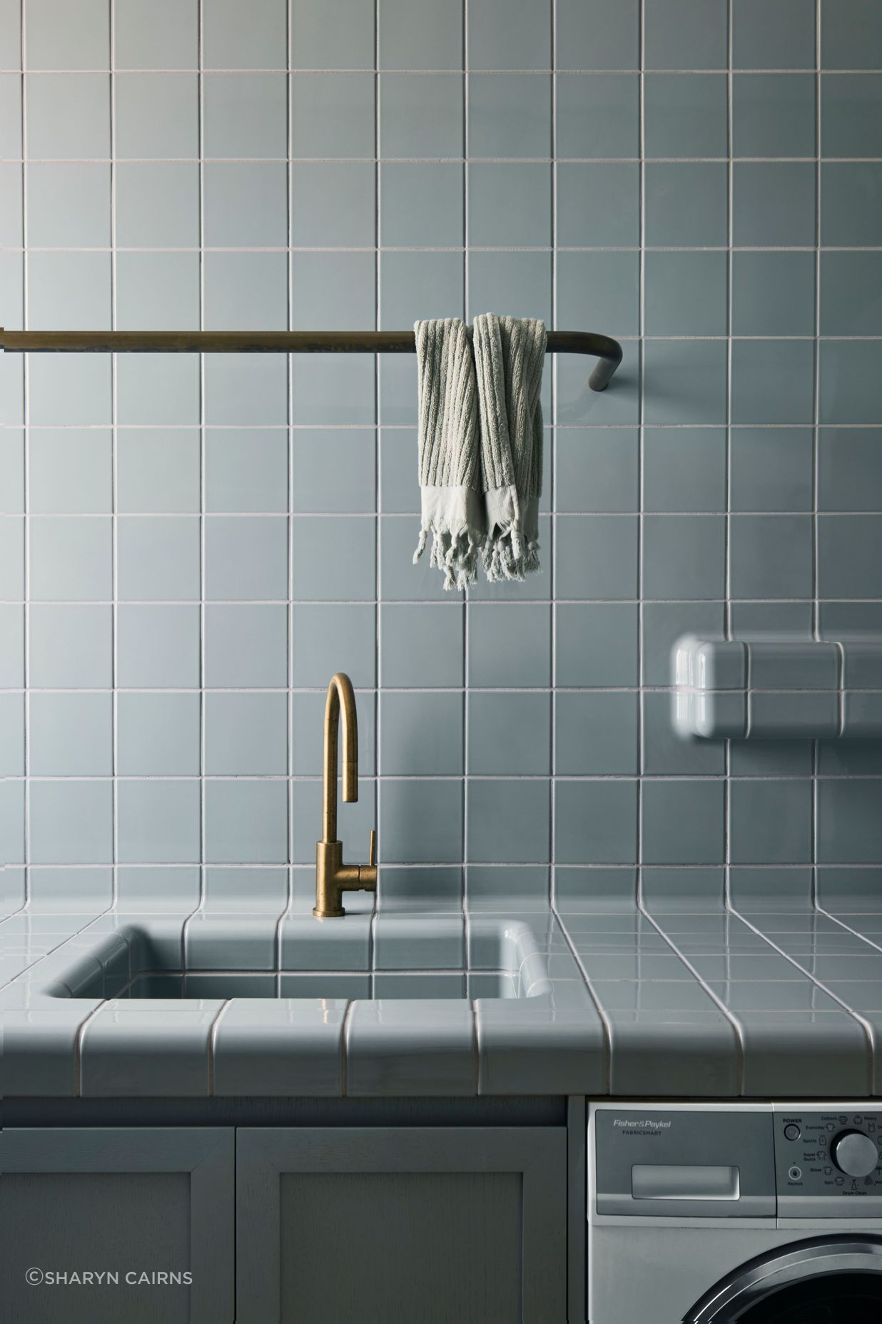 Muted tones in the traditionally tiled laundry.