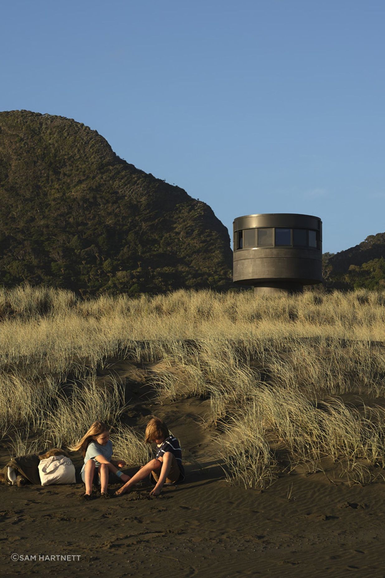 Te Pae, peeking gently over the sand dunes.