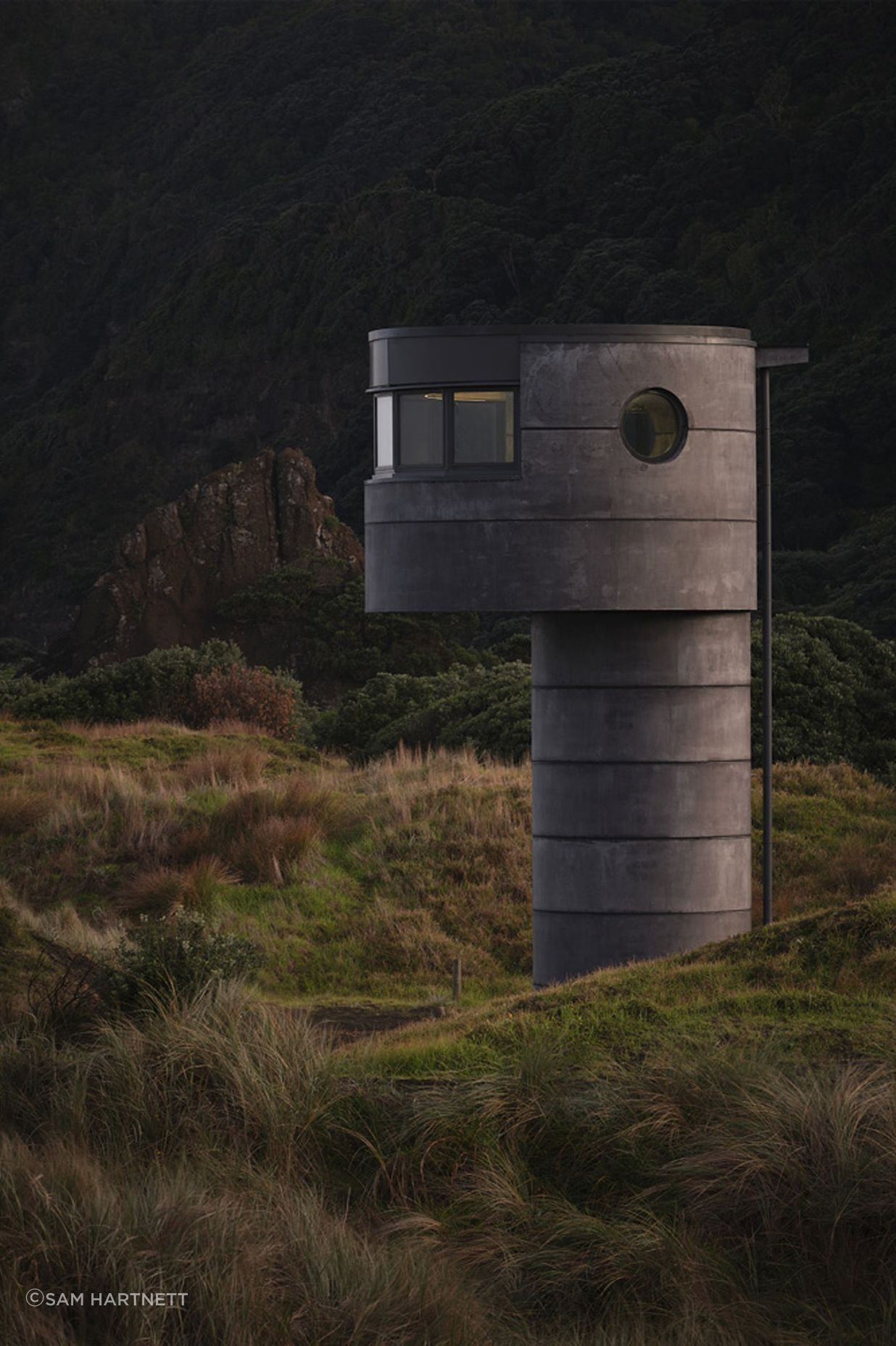 Te Pae's dark, mottled concrete sits beautifully within the wider landscape.