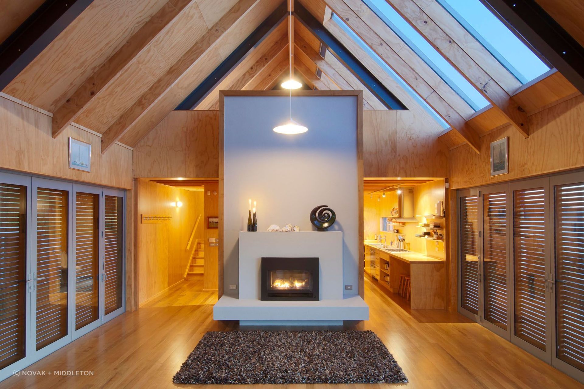 The Boathouse loses little of its sense of space with the shutters closed thanks to its high gable ceiling