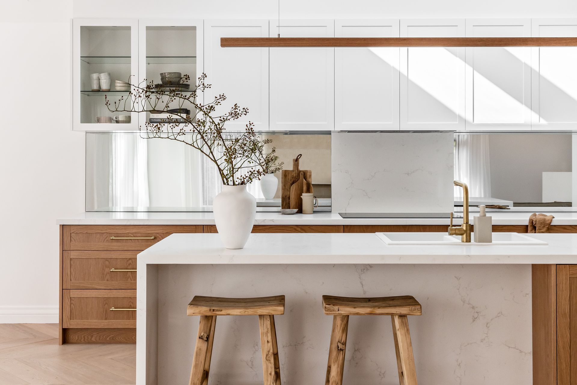 Sticking to one core colour with complementary accents is sometimes all that's needed as the stylish Spanish Mission Coogee Home kitchen shows - Photography: The Palm Co.