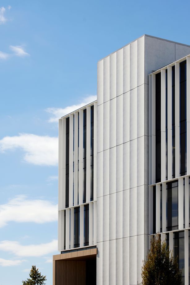 The exterior louvres are functional, carefully allowing natural light into the building's office spaces.