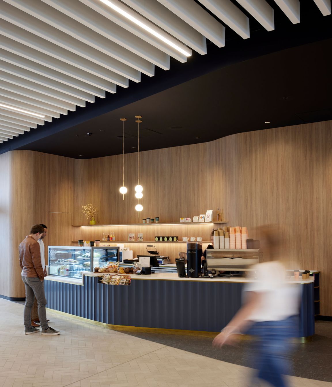 Most tenants in the building do their own fit outs. The pendant lights in the cafe are by Nightworks Studio.