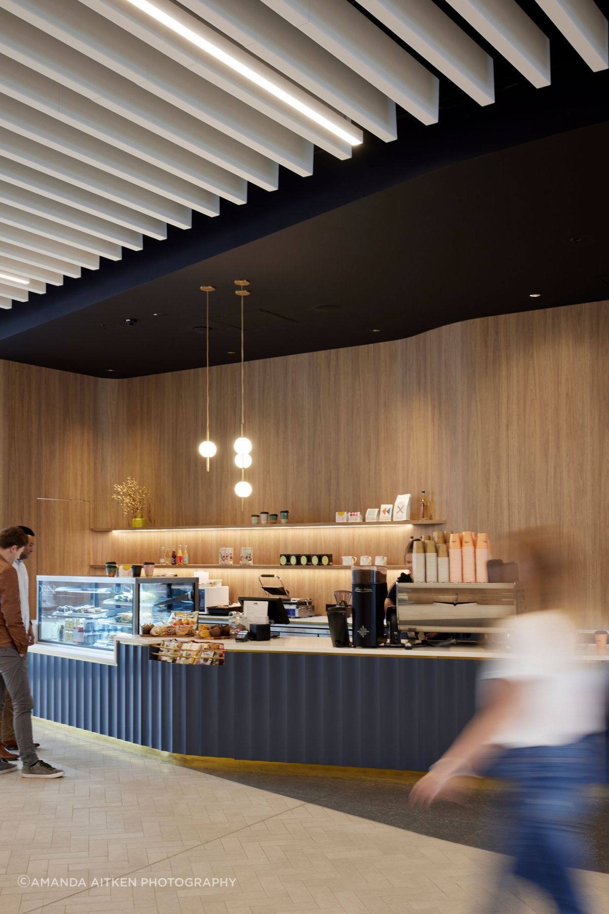 Most tenants in the building do their own fit outs. The pendant lights in the cafe are by Nightworks Studio.