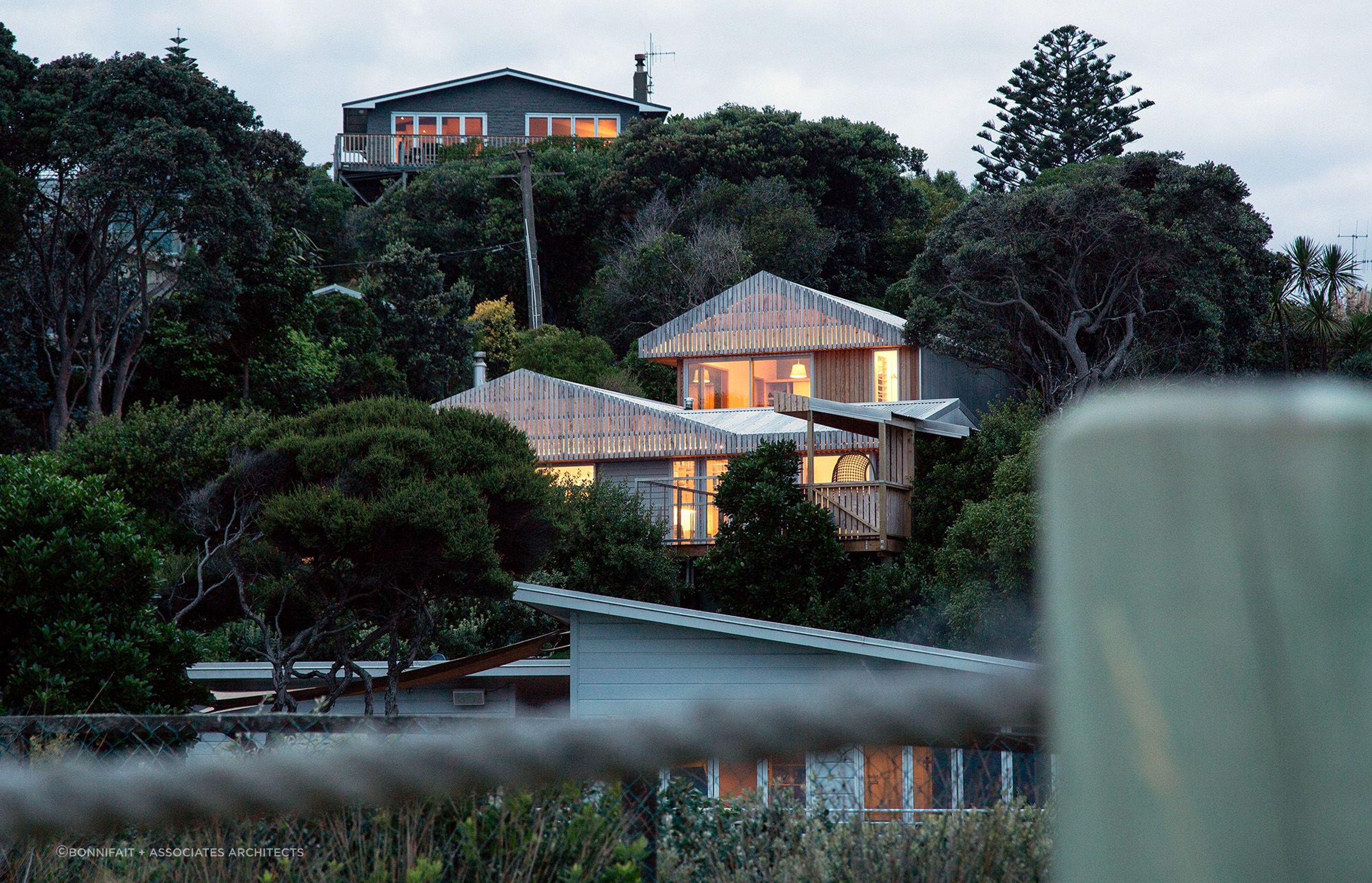 The breathtaking exterior of the Van Den Assum-Eisenhofer House featuring bevelled weatherboards, vertical cedar cladding and macrocarpa slatting. | Photography: Russell Kleyn