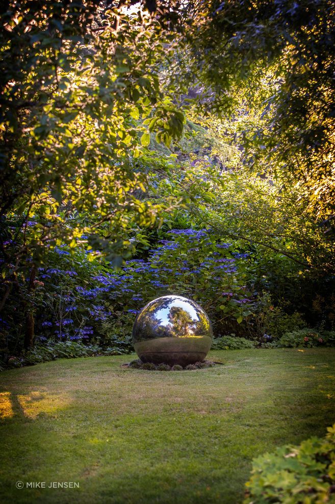 The property of AOME Architects' clients was transformed from a weed-filled, neglected space into a park-like setting.