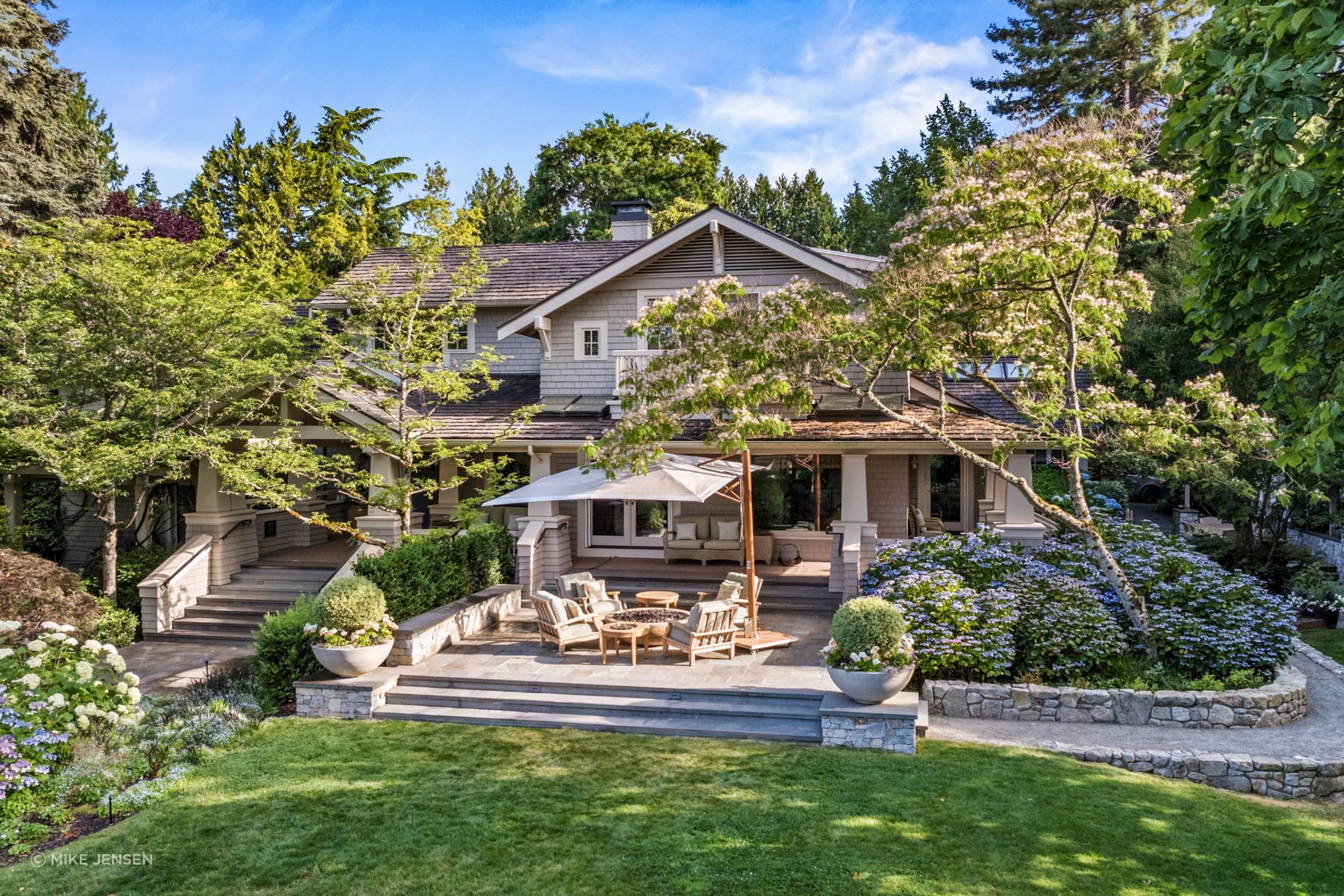 "Our task was to transform this project into a park-like setting that would honor the trees, support
the improvements to the house, and, most of all, give the family a landscape they would actually
inhabit, not merely admire from indoors," says Elster.