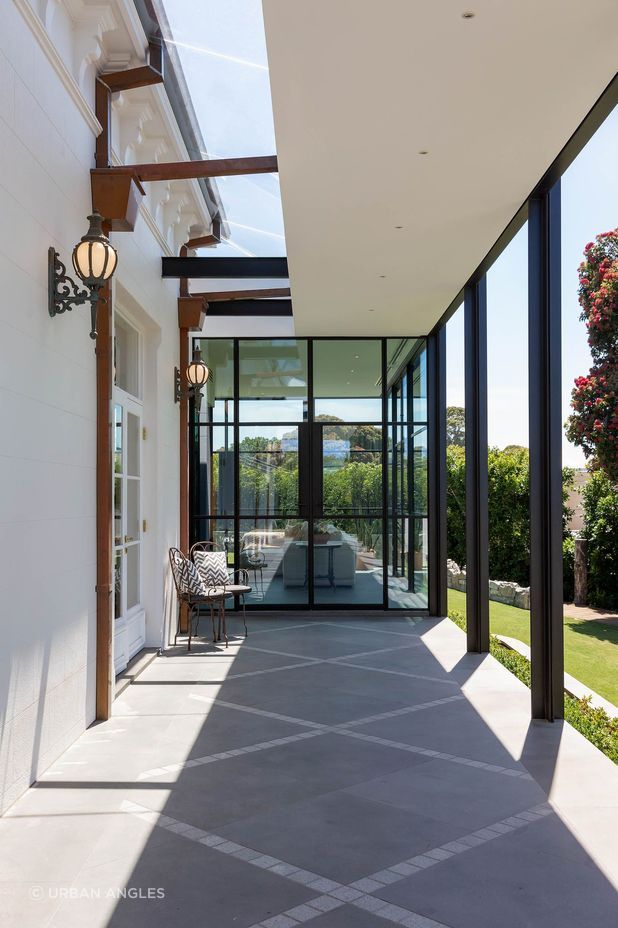 The new extension gracefully wraps the exterior of this heritage-listed home.
