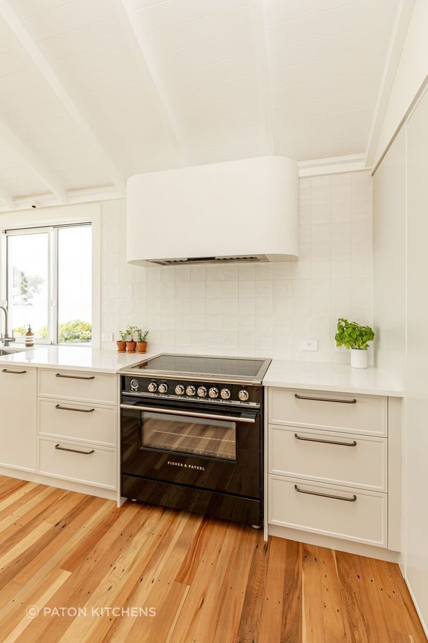 “Functionality is paramount in this bespoke kitchen - integrated Fisher &amp; Paykel appliances ensure that every culinary need is met with ease, while the sleek, modern lines of the appliances complement the kitchen’s overall aesthetic.”