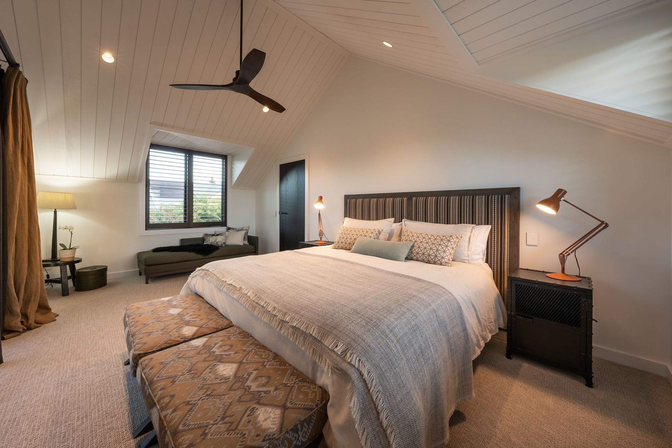 Upstairs in the bedroom wing, simple finishes such as V-groove ply give a homely and cosy feel.
