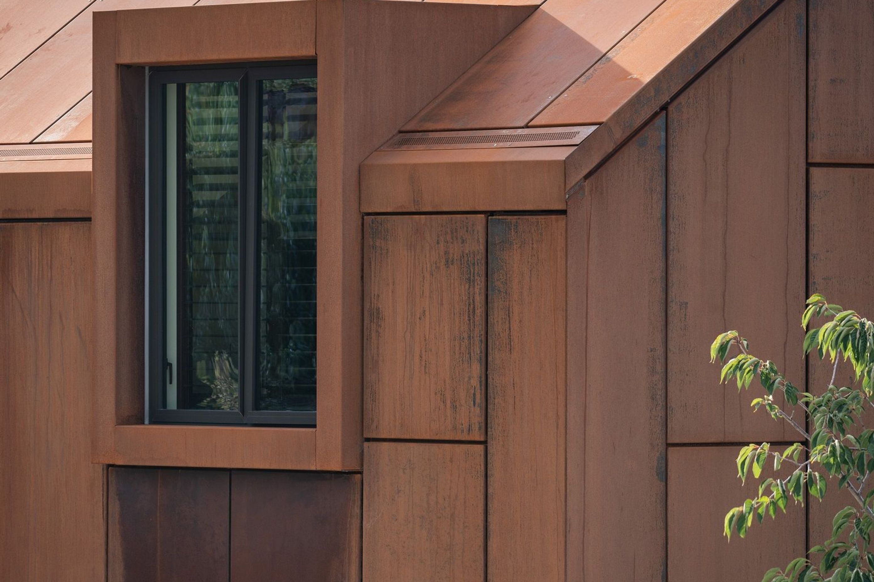 The builders had meticulous attention to detail in crafting the negative detail joins of the corten cladding.