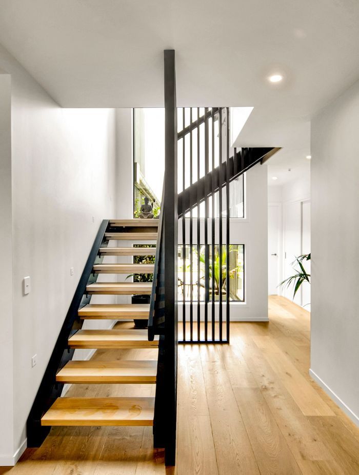 American oak stair treads pair with steel – a feature seen upon entering the home.