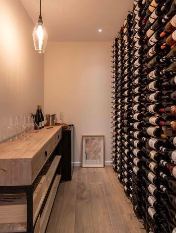 The design included a cellar to house the client's wine collection.