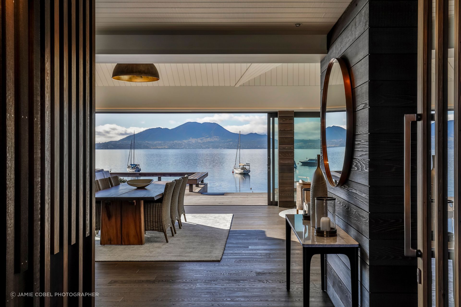 When closed, the beautiful timber front door offers a glimpse of what to expect. When opened, the view is revealed.
