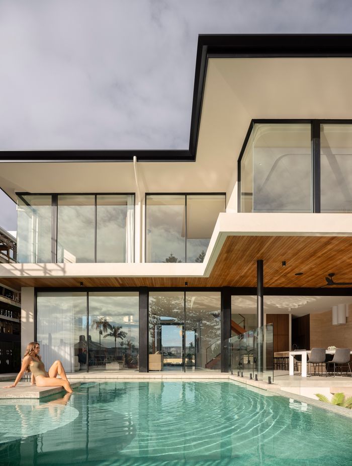 Step straight into the pool from the home's open-plan living space.